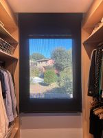 Instalación de cortinas enrollables con tejido técnico screen, referencia PS403 abertura del 3% y color ASH, en vivienda de Gavá