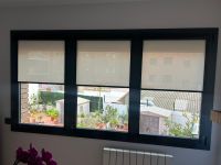 Instalación de cortinas enrollables sistema FIT guía U y tejido técnico screen, referencia PS403 abertura del 3% y color White, en vivienda de Barcelona
