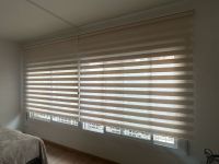 Instalación de cortinas NEOLUX sin cajón, terminal Pocket y color Miami ivory, en vivienda de Barcelona